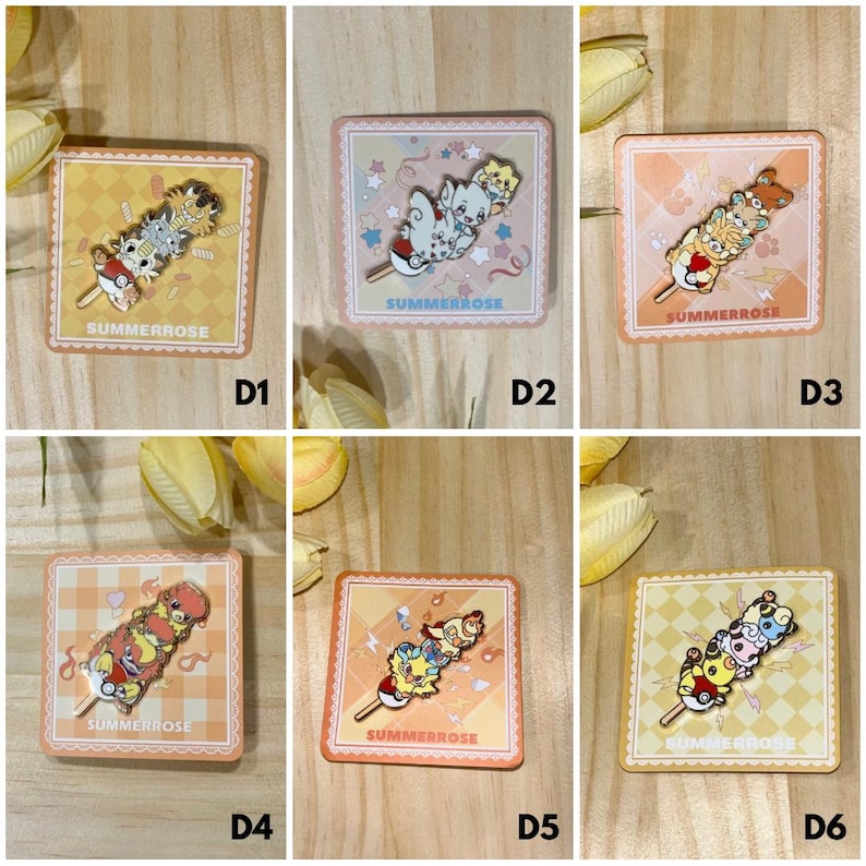 May include: Six square backing cards labeled SUMMERROSE, each displaying a metal enamel pin featuring a stack of three cartoon creatures balanced on a stick. The pins showcase various colorful character designs, including small animals and pokeballs.