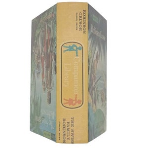 May include: A yellow book with a blue and green illustration of a jungle scene. The book title is "The Swiss Family Robinson" and the author is Johann Wyss. The spine of the book reads "Robinson Crusoe" by Daniel Defoe. The book is part of a "Companion Library" series.