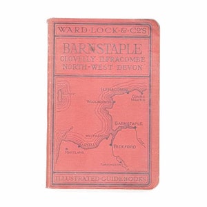 May include: A red illustrated guidebook cover for Barnstaple, Clovelly, Ilfracombe, and North-West Devon. The cover features a map of the region with place names like Barnstaple, Ilfracombe, Clovelly, and Bideford.