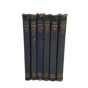 May include: A set of seven vintage hardback books with black covers and gold lettering. The books are titled "Robert Browning's Works" and are published by Smith, Elder & Co.