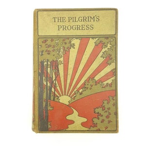 May include: The cover of a vintage book titled "The Pilgrim's Progress". The cover features a stylized illustration of a sunrise over a winding path in a forest.