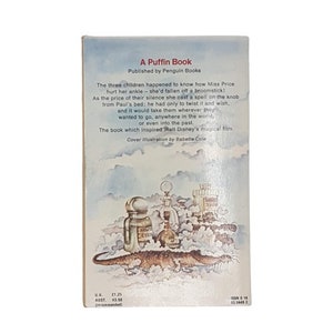 May include: A Puffin Book cover with a whimsical illustration of a crocodile, bottles, and clouds. The book is titled "A Puffin Book" and is published by Penguin Books. The text on the back cover describes the book as a magical story that inspired Walt Disney's film.