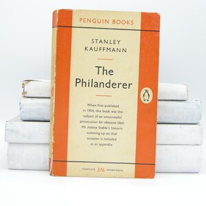 May include: A vintage Penguin Books paperback edition of "The Philanderer" by Stanley Kauffman. The cover is orange with white text and a penguin logo. The book is complete and unabridged.