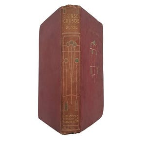 Puede incluir: Un libro antiguo de tapa dura con una cubierta granate y letras doradas. El título es "Robinson Crusoe" de Defoe. El libro forma parte de "Blackie's Library of Famous Books".