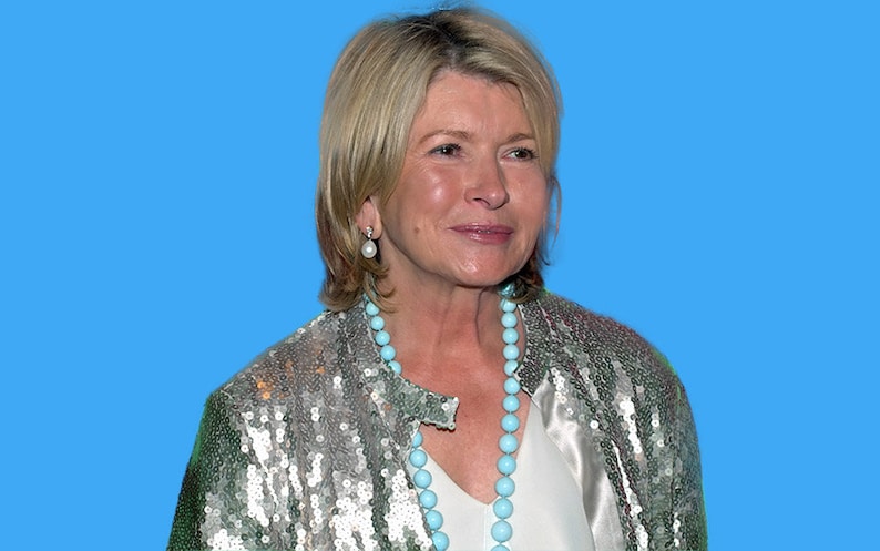 May include: A woman with short blonde hair wearing a silver sequined jacket with a turquoise beaded necklace and pearl earrings.