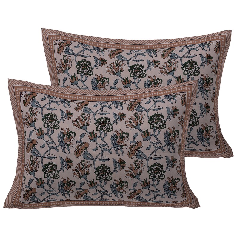 May include: Two pillowcases featuring a floral design in shades of brown, pink, and green. The pillowcases have a brown border with a geometric pattern.