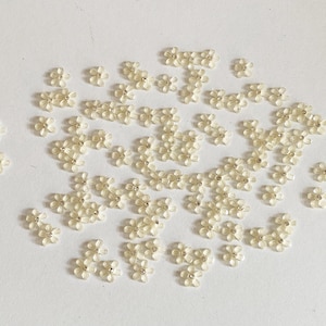 Bundle 91pcs Mini Acrylic Flower Embellishments Ivory 5-Petal Blossoms with Rhinestone Center for Crafts, Nail Art, DIY Projects