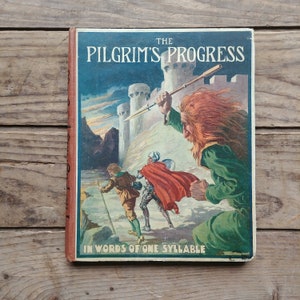 May include: A vintage book cover with an illustration of a giant with a spear attacking two figures. The book title is "The Pilgrim's Progress" and the subtitle is "In Words of One Syllable".