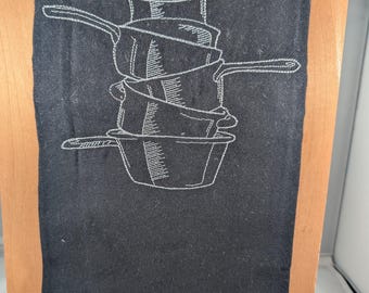 Black embroidered dishtowel with hanging tag. 18x28"