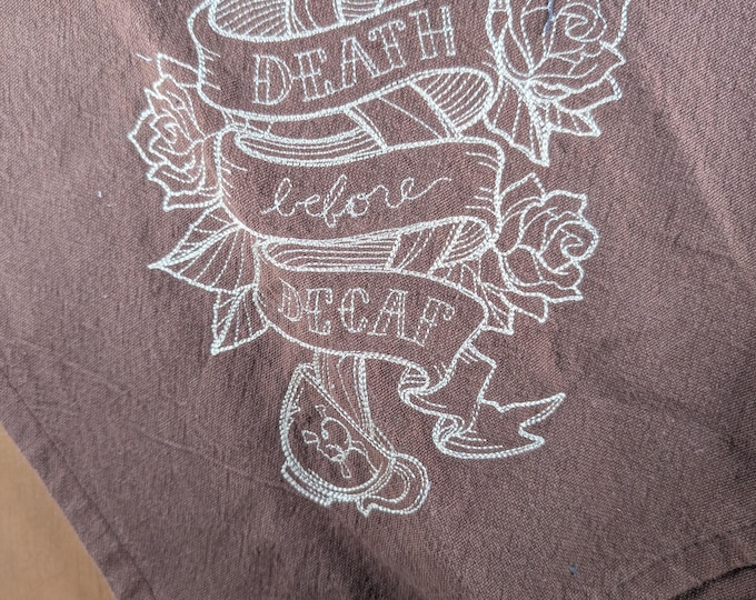 Brown embroidered flat weave dishtowel with hanging tab. 18x28"