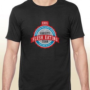 May include: Black t-shirt with a blue and red circular logo that says "Midwestern Polytechnic University Varsity Flesh Eating Team Fighting Blivets" in white text.