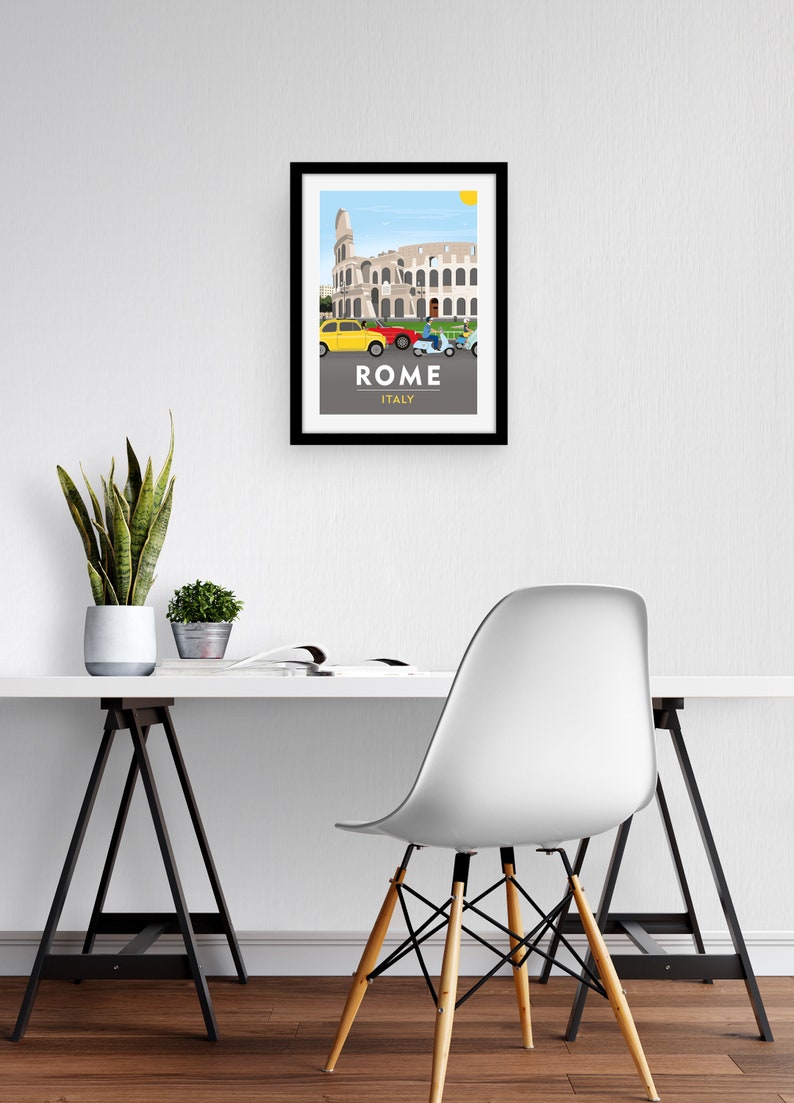 May include: A framed illustration of the Colosseum in Rome, Italy. The illustration features a yellow car, a red car, and two scooters driving past the Colosseum. The text "ROME ITALY" is printed below the illustration.