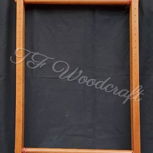 May include: Wooden loom with two wooden dowels and red string. The loom is made of natural wood and has a rectangular shape.