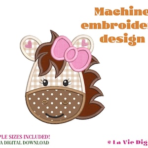 May include: Machine embroidery design of a brown and white checkered horse head with a pink bow and brown mane. The horse has brown eyes and a brown nose. The design includes the text "Machine embroidery design".