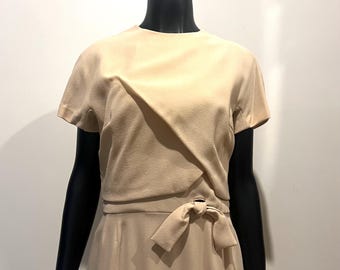 Stylish vintage 1960’s Pierre Balmain nude coloured dress with button up back detail and faux tie front.