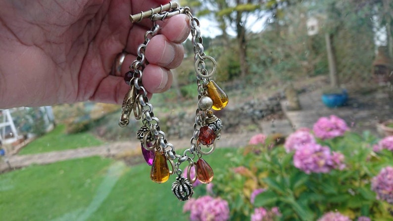 Superb 192030s Rhodium plated charm bracelet.