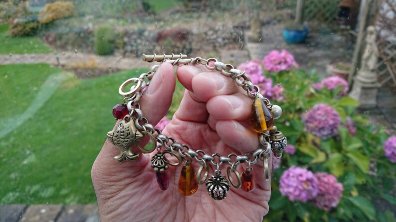 Superb 192030s Rhodium plated charm bracelet.