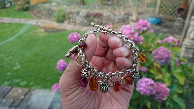 Superb 192030s Rhodium plated charm bracelet.