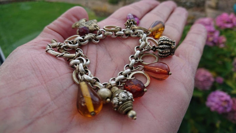 Superb 192030s Rhodium plated charm bracelet.