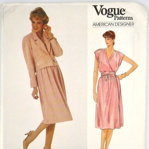 May include: Vogue Patterns American Designer sewing pattern for a pink dress and jacket by Adele Simpson. The pattern number is 2920.
