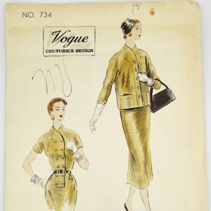May include: Vintage Vogue Couturier Design sewing pattern. The illustration features a mustard-colored suit with a pencil skirt and a matching jacket. The pattern also includes a shorter-sleeved dress design. The text reads "Exclusive Design Created by Vogue."
