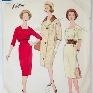 May include: A vintage sewing pattern featuring three women's dresses. The dresses are a red dress with a white collar, a white dress with a brown collar, and a cream dress with a brown belt. The pattern is titled "Vogue Paris Original" and designed by "Patou". The pattern number is "1461".