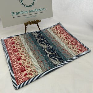 May include: A rustic wooden sign with the text "Welcome to our home" in white lettering. The sign features a distressed finish and a simple, inviting design, perfect for a front porch or entryway.