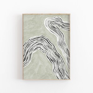 May include: Abstract art print with black and white lines on a sage green background. The lines are curved and create a flowing, organic shape.