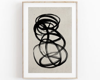 May include: Abstract art print featuring a black ink design on a beige background, framed in a light wood. The artwork showcases a series of overlapping, swirling lines, creating a dynamic and textured composition. The minimalist style adds a modern touch to any space.