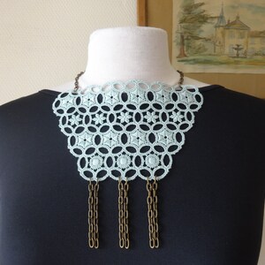 Very Peri bib necklaces, black, anise/Caribbean green, ivory, taupe; floral lace; brass/silver metal decoration; boho