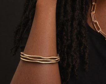 Set Of Three Gold-Plated Wave-Edge Bangle Bracelet Stack
