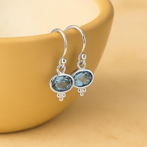 Sterling Silver Oval Blue Topaz Drop Earrings