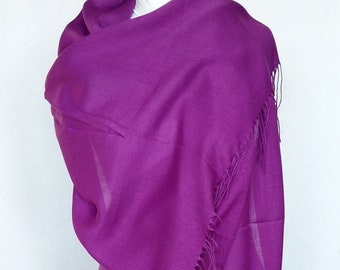 May include: A purple pashmina shawl with fringe. The shawl is draped over a mannequin.