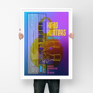 May include: A poster with a blue, purple, and yellow gradient background. The poster features a stylized illustration of a keyboard with hands playing it. The text "Head Hunters" is in yellow and the text "Roger Hancock" is in white. The poster also includes the names of the band members: "Charleston, Butterfield, Paul, Sax, Josh Melter".