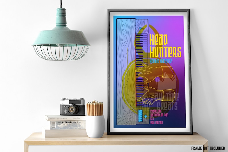 May include: A colorful poster with a graphic illustration of a keyboard and hands playing it. The text "Head Hunters" and "Herbie Hancock" are featured in yellow. The poster has a blue, purple, and pink gradient background.