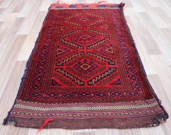 1970年代のアフガン・バルーチウールラグ：赤い部族の枕カバー、3.4 x