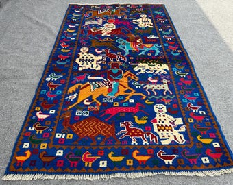 May include: A colorful rug with a blue background and a variety of animal and human figures woven into the design. The rug features a variety of colors, including red, yellow, green, and orange.