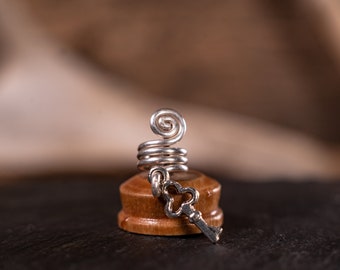 Handmade silver plated spiral metal dreadlock bead, with key trinket charm