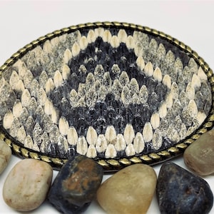 Genuine Rattlesnake belt buckle with rope edge,Usually, item(s) in stock. IF not in stock, please anticipate a 2-3 week processing time.