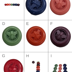 May include: Nine round, colorful wax melts with a bee design. The wax melts are arranged in a row, with the colors ranging from orange to green to blue.