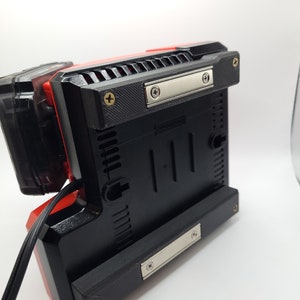 Milwaukee M12 M18 Charger Mount, Cat. No. 48-59-1812, Uses Two Neodymium Bar Magnets for Strong Hold on Metal Surface