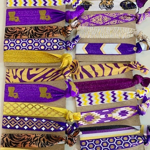 LSU Hair Ties, Set of 6 Hair Ties in LSU purple and gold! Wear on your wrist until you need to put your hair up. Tiger fans will love this!