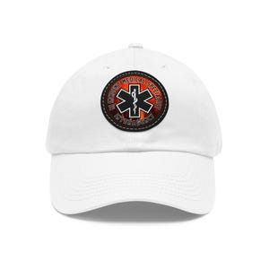 May include: White baseball cap with a black and red embroidered patch that says "Incident Medical Specialist Interagency". The patch features a medical symbol with a snake wrapped around a staff.