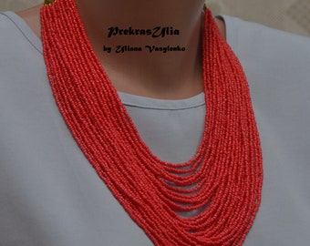 Coral-colored beaded necklace, many beaded threads in the style of ethno to Ukrainian vyshyvanka