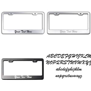 May include: Two silver and one black license plate frames with the text "Your Text Here" on each. The frames are made of metal and have a shiny finish. The image also shows the alphabet in a stylized font.