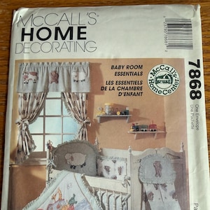 May include: A McCall's Home Decorating sewing pattern envelope, number 7868, titled Baby Room Essentials. The cover features illustrations of a crib, curtains, and bedding decorated with animal motifs, including a Noah's Ark scene and teddy bears.