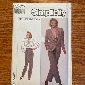 May include: Simplicity sewing pattern for Sung Sport, size 16. The pattern envelope features illustrations of a woman in a blazer and trousers, and another in a blouse and trousers. The envelope is white with the Simplicity logo.