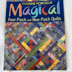 May include: A book titled "Magical Four-Patch and Nine-Patch Quilts" by Yvonne Porcella. The cover features a colorful patchwork design with squares and rectangles in shades of blue, green, red, and yellow. The title is in vibrant, multi-colored lettering.