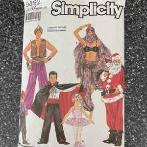 May include: Simplicity sewing pattern 9892 for various costumes, including a Santa Claus suit, a vampire outfit, and an Arabian Nights ensemble. The package features illustrations of the costumes and the text "TURBAN NOT INCLUDED".