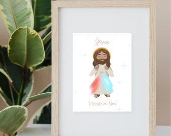 May include: A framed print featuring a cartoon illustration of Jesus with a halo, wearing a white robe. The text "Jesus" is at the top, and "I trust in You" is at the bottom. The image has red and blue rays emanating from the chest.